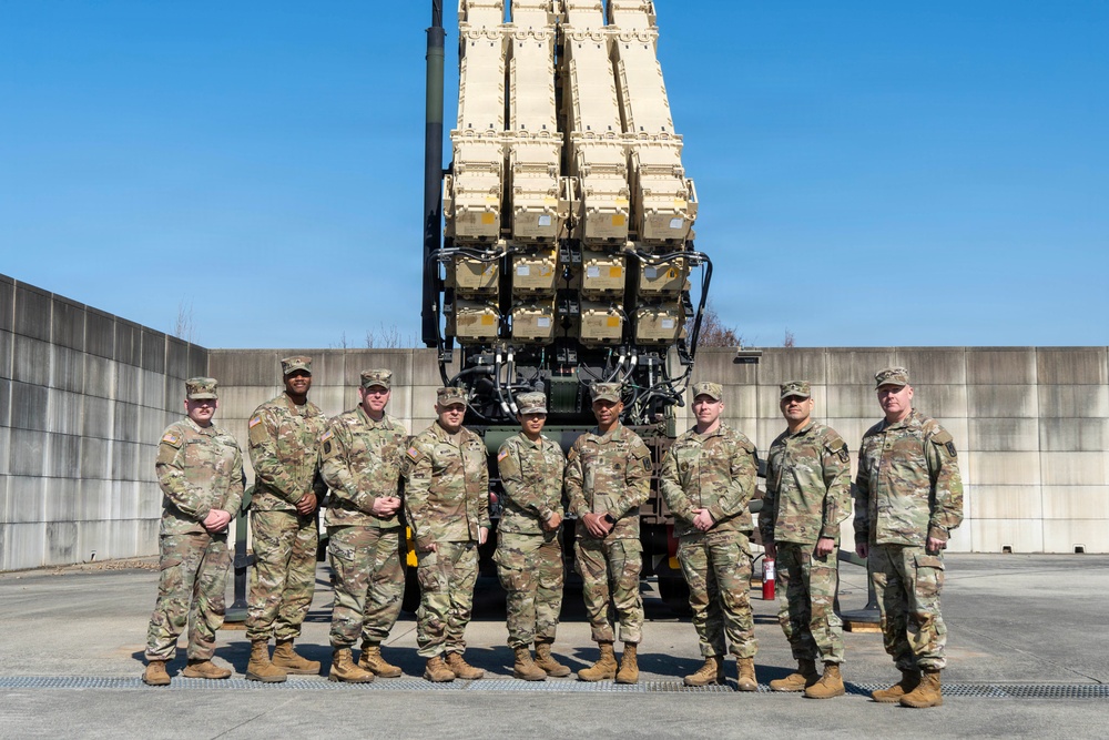 Leadership from Delta Battery, 6-52 Battalion, 35th Air Defense Artillery Brigade and Command Sergeant Weaver Pose in Front of Launchers