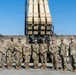 Leadership from Delta Battery, 6-52 Battalion, 35th Air Defense Artillery Brigade and Command Sergeant Weaver Pose in Front of Launchers