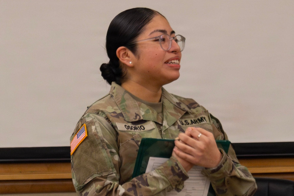 Sergeant Osorio is presented the Army Commendation Medal from the 35th Air Defense Artillery Brigade