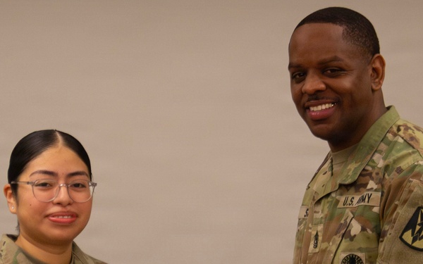 Sergeant Osorio is presented the Army Commendation Medal from the 35th Air Defense Artillery Brigade