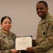 Sergeant Osorio is presented the Army Commendation Medal from the 35th Air Defense Artillery Brigade
