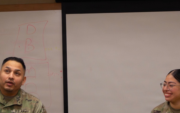 Sergeant Osorio is presented the Army Commendation Medal from the 35th Air Defense Artillery Brigade