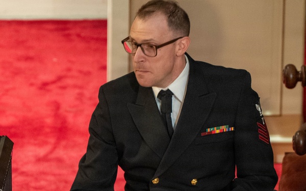 Musician 1st Class David Agee of the US Navy Band Sea Chanters performs at St. John's Episcopal Church in New Hampshire during their 2026 National Tour