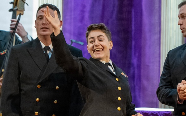 Chief Musician Amy Broadbent of the US Navy Band Sea Chanters performs at St. John's Episcopal Church in New Hampshire during their 2026 National Tour