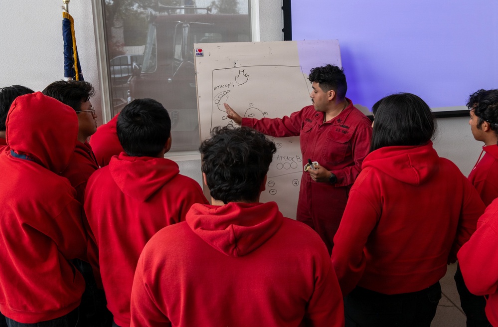 Navy Recruiter Returns to Alma Mater to Lead Damage Control Drill