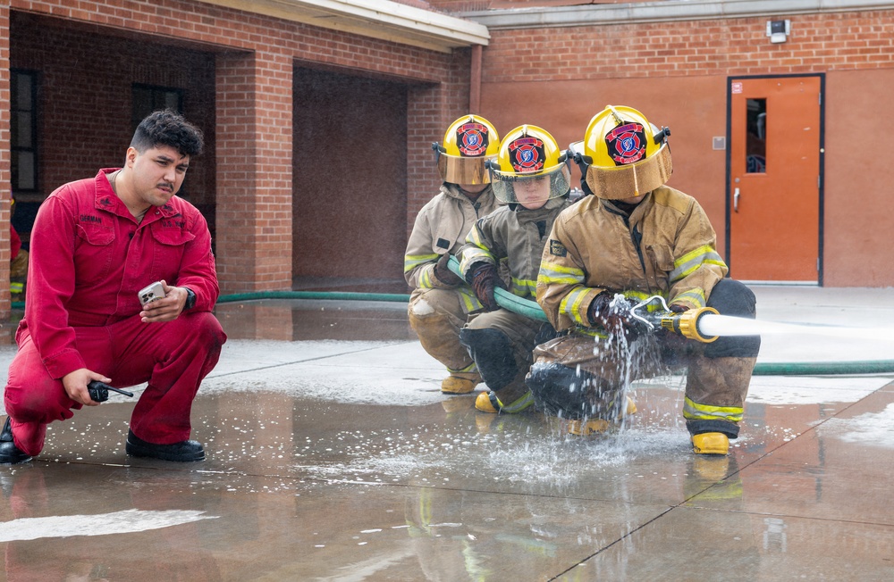 Navy Recruiter Returns to Alma Mater to Lead Damage Control Drill