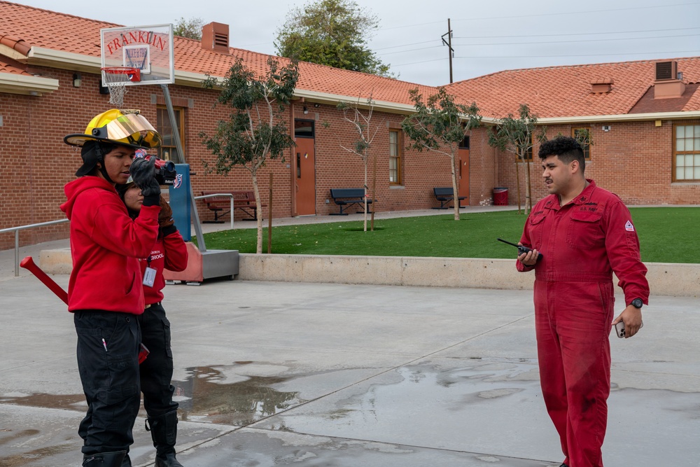 Navy Recruiter Returns to Alma Mater to Lead Damage Control Drill