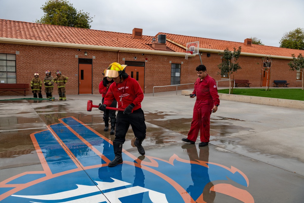 Navy Recruiter Returns to Alma Mater to Lead Damage Control Drill