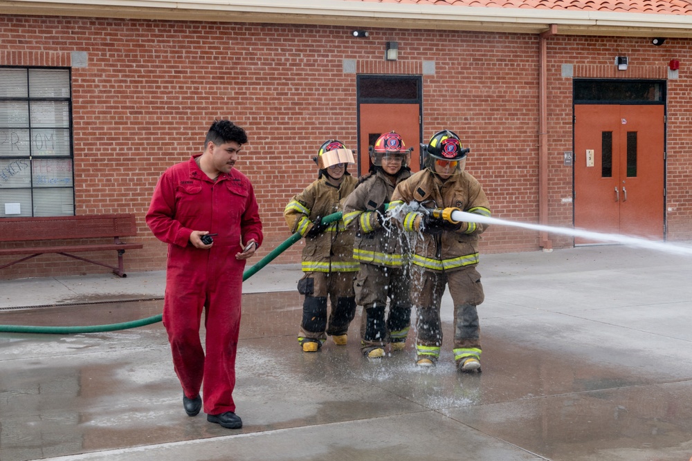 Navy Recruiter Returns to Alma Mater to Lead Damage Control Drill