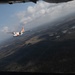 A U.S. Coast Guard HC-144 Ocean Sentry flies over Auburn, Alabama