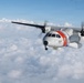 A U.S. Coast Guard HC-144 Ocean Sentry flies above the clouds