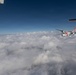 A U.S. Coast Guard HC-144 Ocean Sentry flies above the clouds