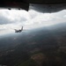 A U.S. Coast Guard HC-144 Ocean Sentry flies over Auburn, Alabama