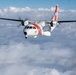 A U.S. Coast Guard HC-144 Ocean Sentry flies above the clouds