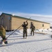US Marines construct a field expedient antenna during ARCTIC EDGE 2026