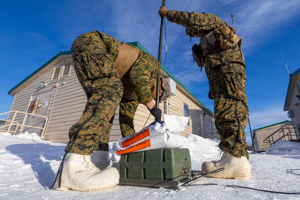 US Marines construct a field expedient antenna during ARCTIC EDGE 2026