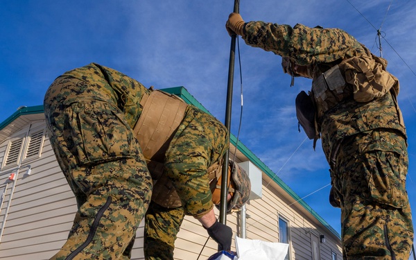 US Marines construct a field expedient antenna during ARCTIC EDGE 2026