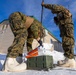 US Marines construct a field expedient antenna during ARCTIC EDGE 2026