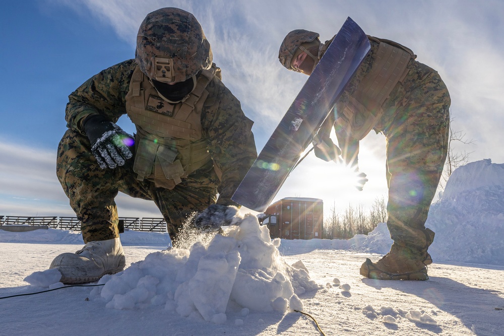 US Marines construct a field expedient antenna during ARCTIC EDGE 2026