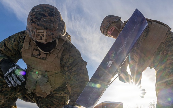 US Marines construct a field expedient antenna during ARCTIC EDGE 2026