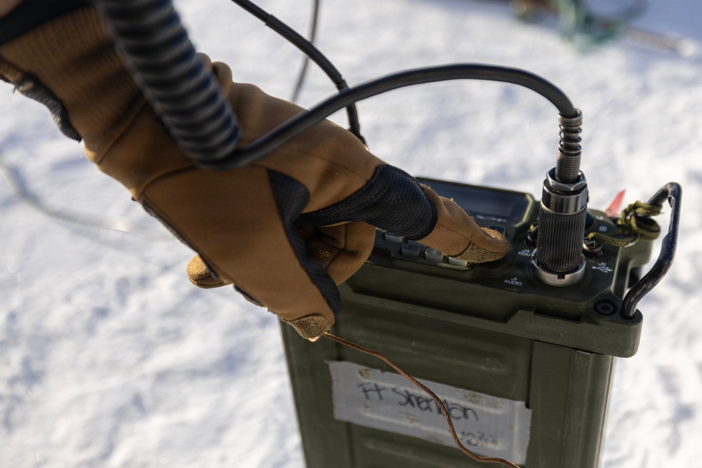 US Marines construct a field expedient antenna during ARCTIC EDGE 2026