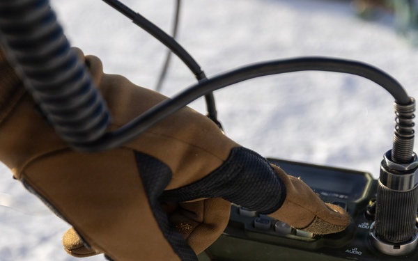 US Marines construct a field expedient antenna during ARCTIC EDGE 2026
