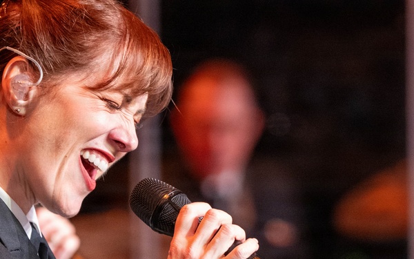Chief Musician Maia Rodriguez of the US Navy Band Sea Chanters performs at the Sanford Performing Arts Center