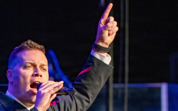 Musician 1st Class Nate Buttram of the US Navy Band Sea Chanters performs at the Sanford Performing Arts Center