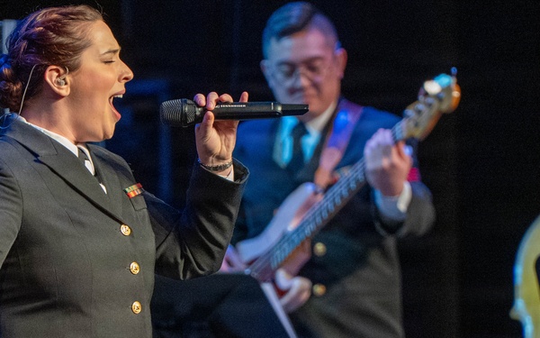 Musician 1st Class Michaela Ford of the US Navy Band Sea Chanters performs at the Sanford Performing Arts Center