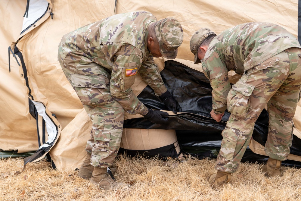 The Headquarters team from the 25th Transportation Battalion honed their skills, conducting a training exercise focused on setting up their main operations tent on Feb. 26.