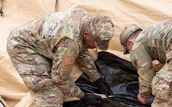 The Headquarters team from the 25th Transportation Battalion honed their skills, conducting a training exercise focused on setting up their main operations tent on Feb. 26.