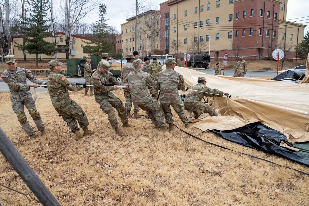 The Headquarters team from the 25th Transportation Battalion honed their skills, conducting a training exercise focused on setting up their main operations tent on Feb. 26.