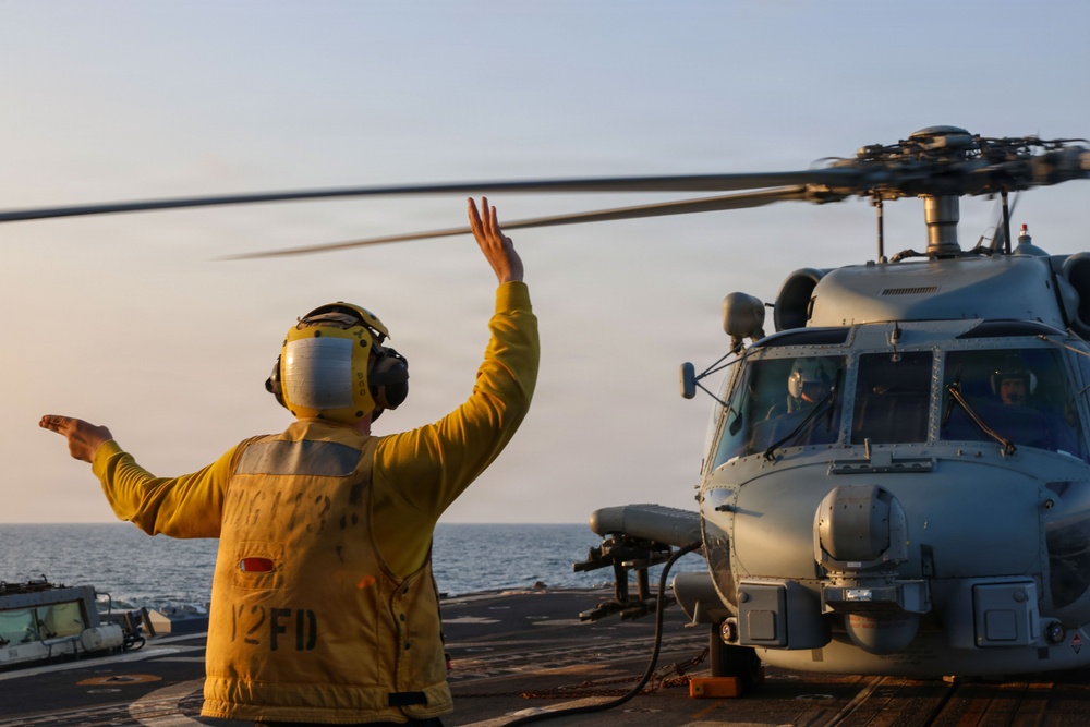 Sailors aboard the USS John Finn conduct flight quarters in the U.S. Central Command area of responsibility