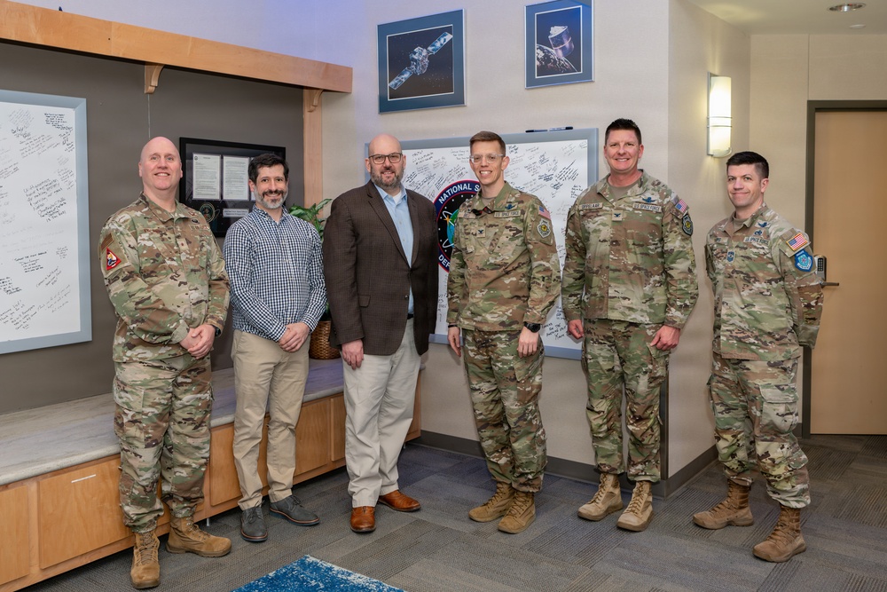 U.S. Space Forces—Space (S4S), Space Delta 15, and National Space Defense Center leadership stand with Ryan Pettit, Senate Armed Services Committee professional staff member.