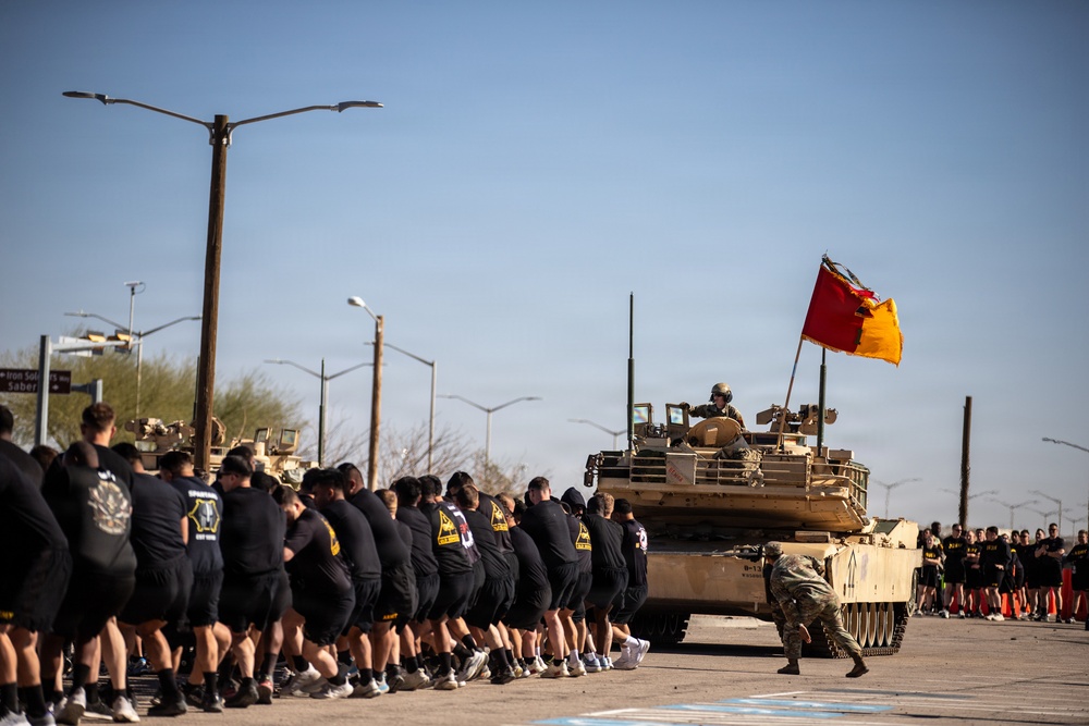 A test of strength: 1st Armored Division Soldiers pull tanks to glory