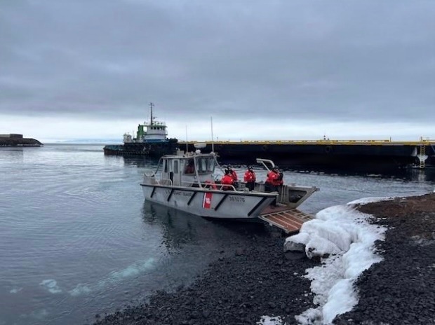 USCGC Polar Star (WAGB 10) supports the installation of a pier in McMurdo Station during Operation Deep Freeze 2026