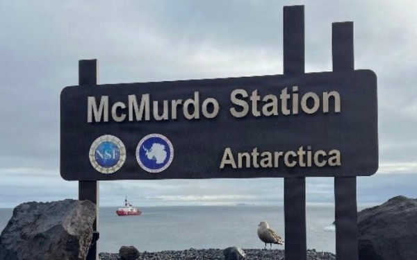 USCGC Polar Star (WAGB 10) supports the installation of a pier in McMurdo Station during Operation Deep Freeze 2026