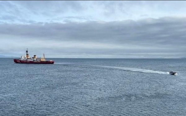 USCGC Polar Star (WAGB 10) supports the installation of a pier in McMurdo Station during Operation Deep Freeze 2026