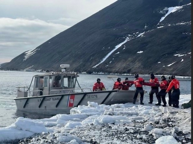 USCGC Polar Star (WAGB 10) supports the installation of a pier in McMurdo Station during Operation Deep Freeze 2026