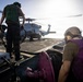 U.S. Sailors, assigned to the Iwo Jima Amphibious Ready Group, reel in a fuel line