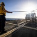 U.S. Sailor, assigned to the Iwo Jima Amphibious Ready Group, signals Sailors to remove chocks and chains