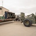 Airmen load an old and disabled snowblower