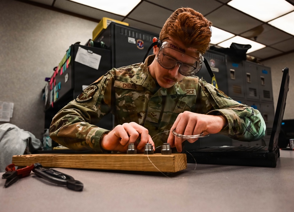 513th Maintenance Squadron Airmen practice safety wiring