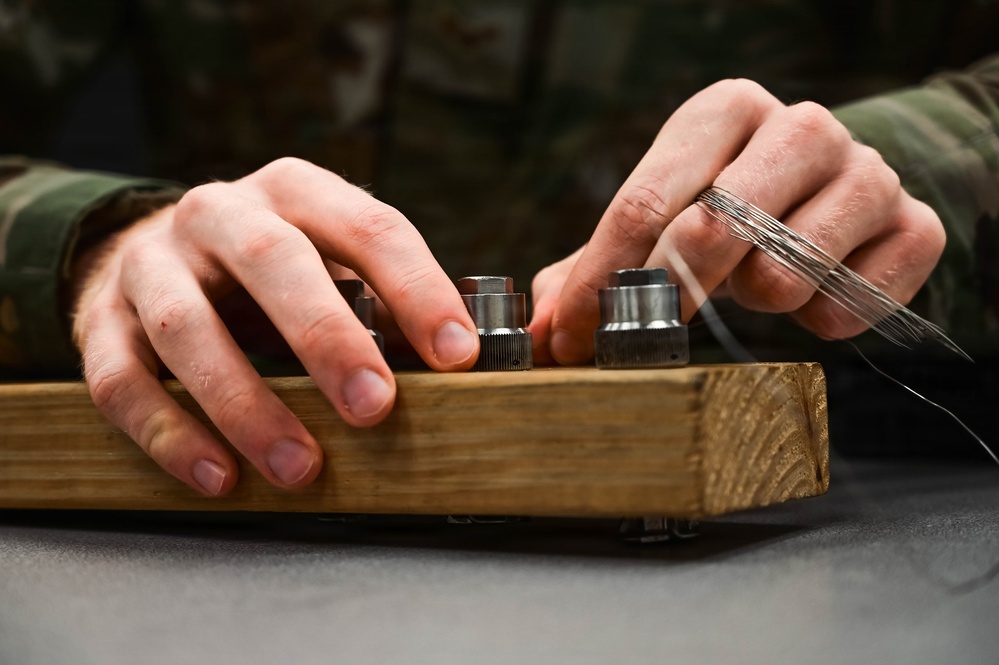 513th Maintenance Squadron Airmen practice safety wiring