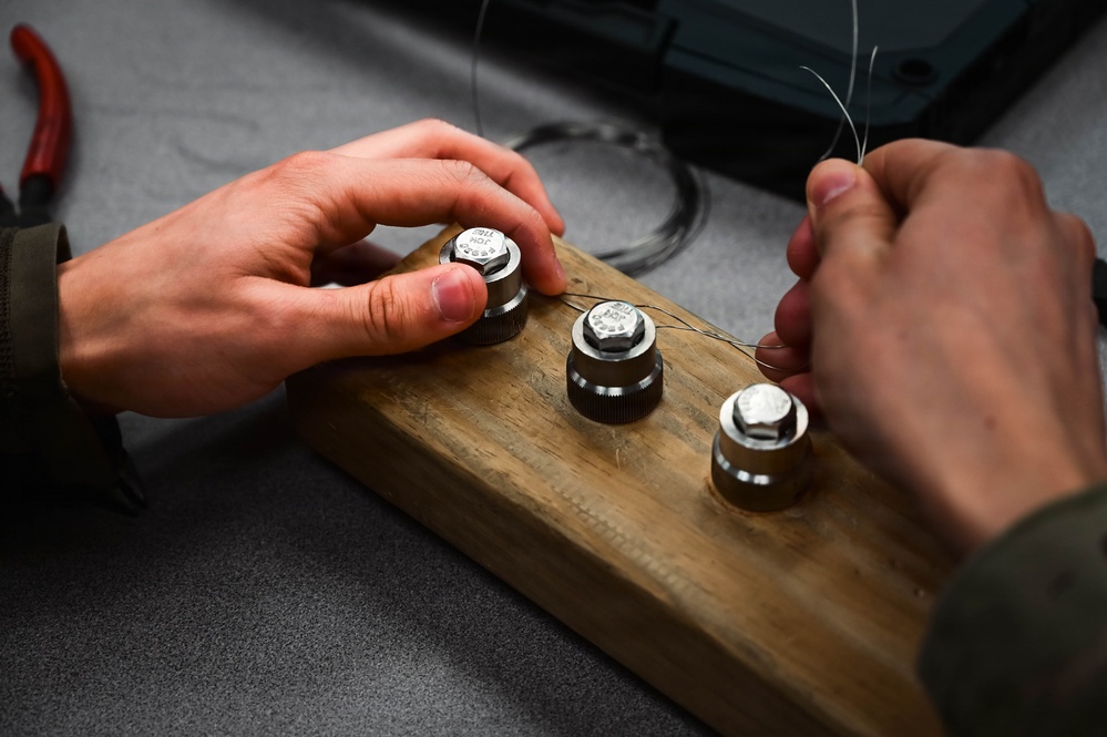 513th Maintenance Squadron Airmen practice safety wiring