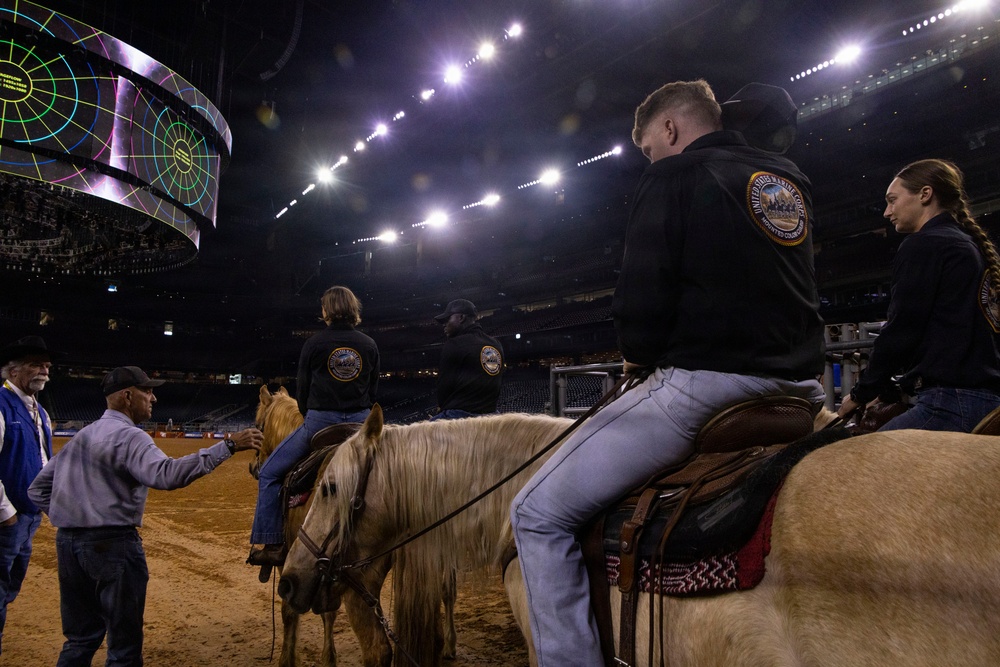 U.S. Marine Corps Mounted Color Guard presents the colors at the Houston Rodeo