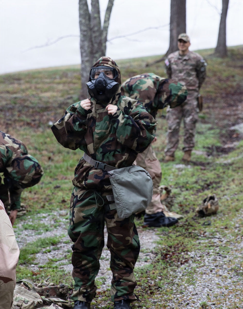 Competitor dons MOPP gear
