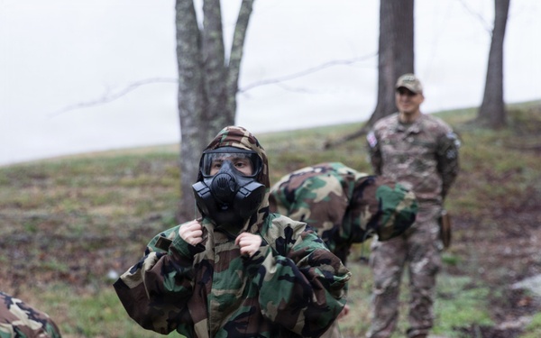 Competitor dons MOPP gear