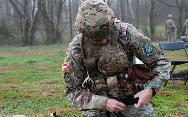 Competitor applies tourniquet