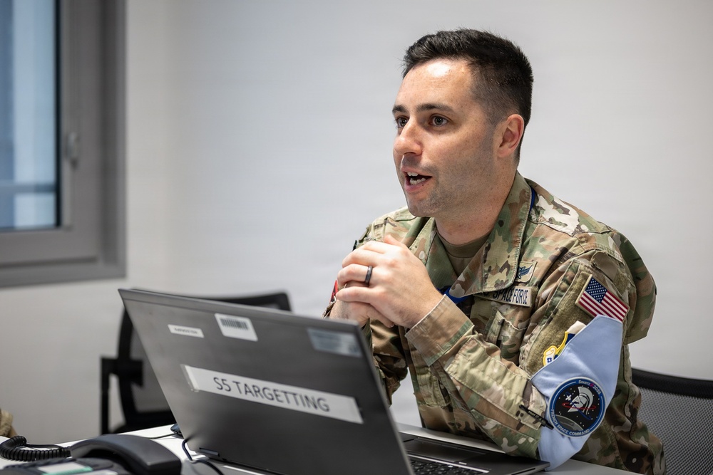 U.S. Space Force Capt. Tyler Riechmann, Space Delta 5 special technical operations deputy division chief, collaborates with international partners during Exercise SPARTEX 2026 at the French Space Command headquarters in Toulouse, France, March 9, 2026.